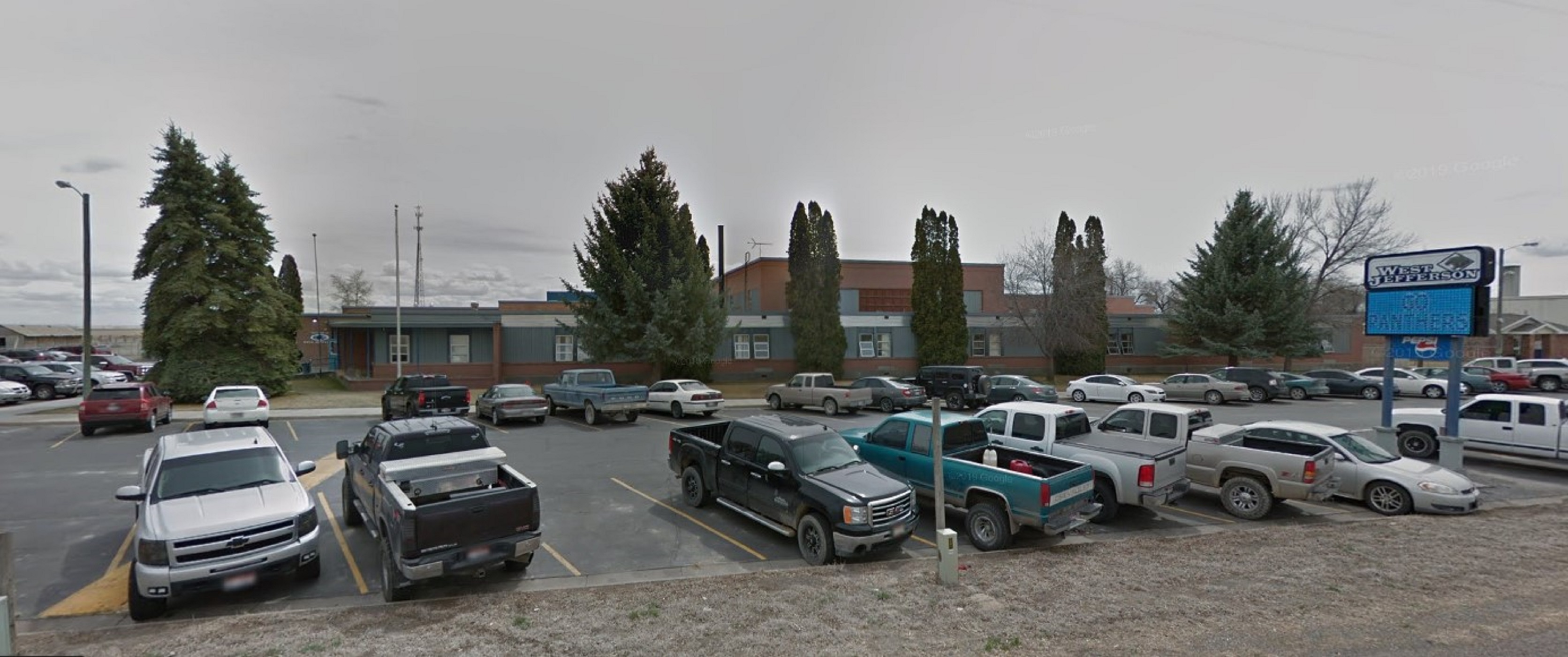 cars parked in front of school